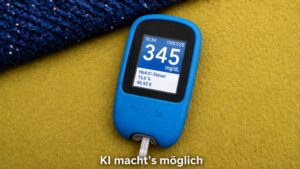 Blutzuckermessgerät mit satirischer HbA1c-Steuer und errechnetem Euro-Betrag. KI-generierte Darstellung auf Basis eines eigenen Fotos.